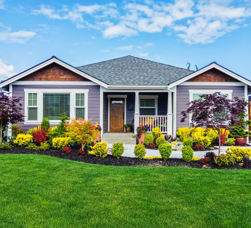 Colorful garden in front of a house.
