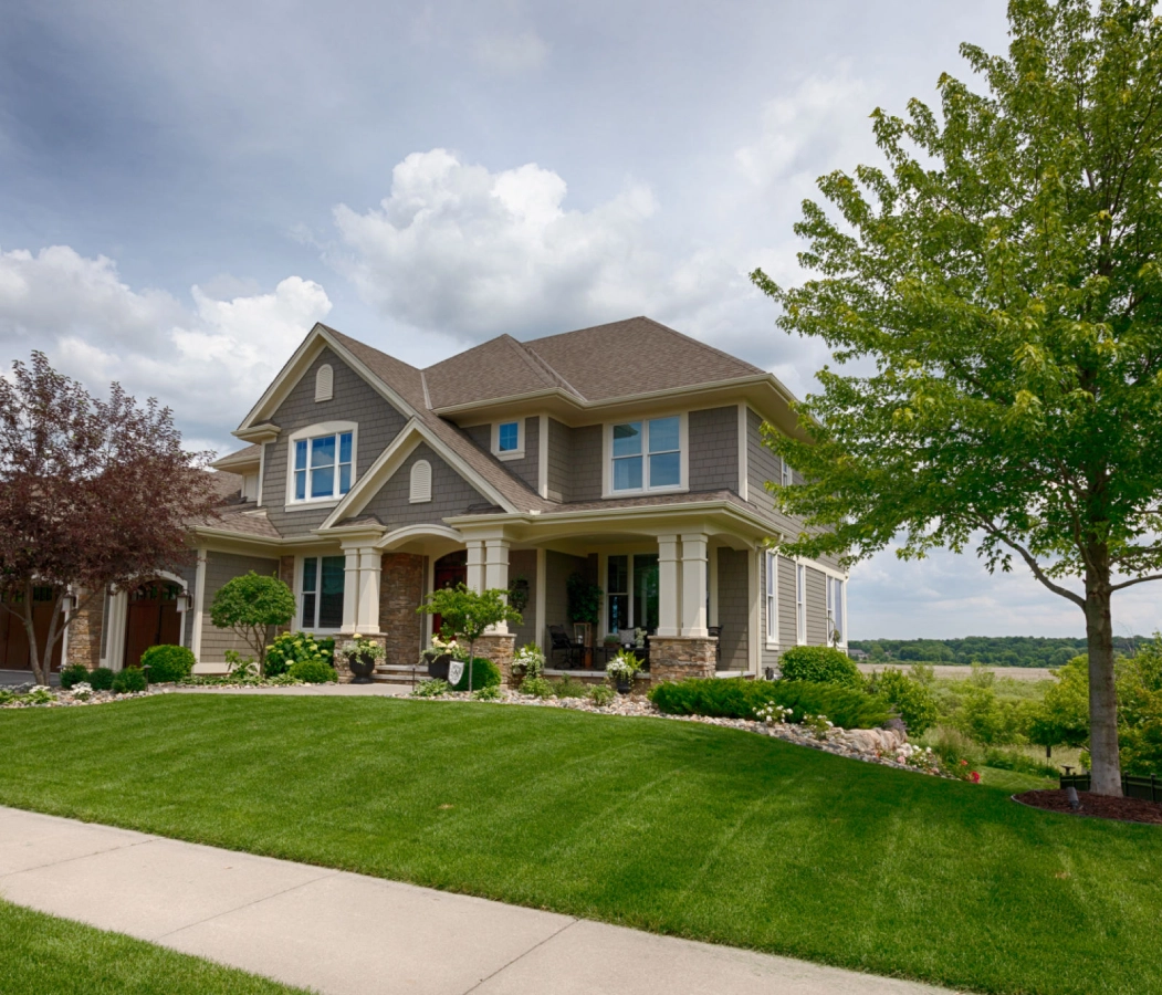 Suburban house with lush green lawn.