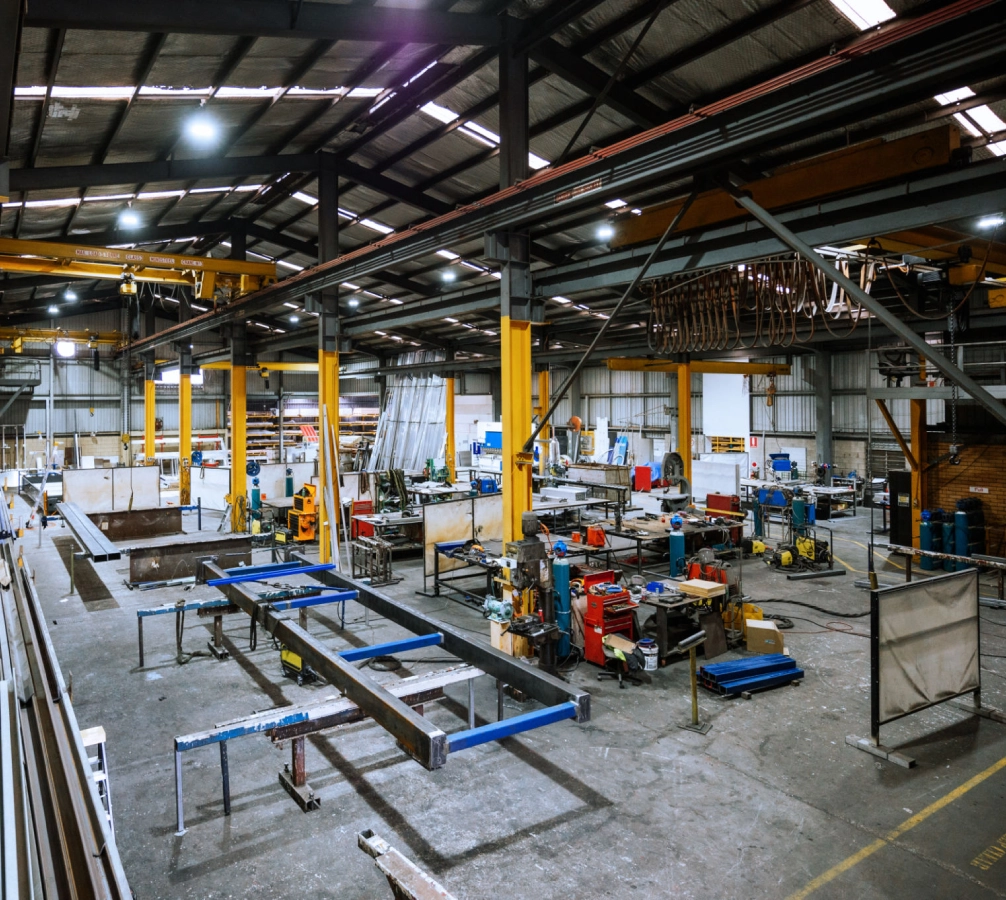 Industrial warehouse with machinery and equipment inside.